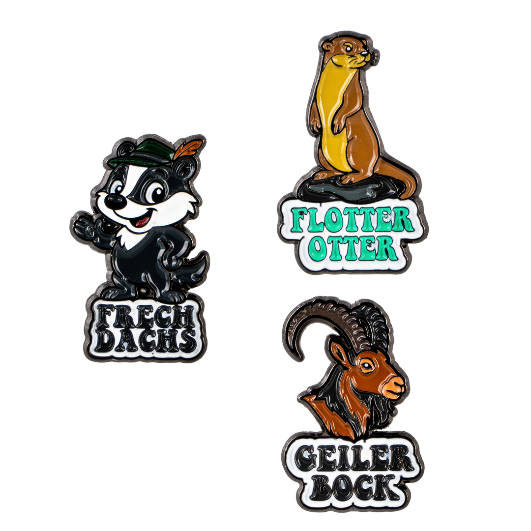 Bayerische Wiesn-Pins mit Tiermotiven – Frech Dachs, Flotter Otter und Geiler Bock als Trachtenanstecker